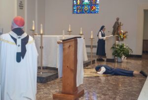 Sr Khristina prostrates before the altar